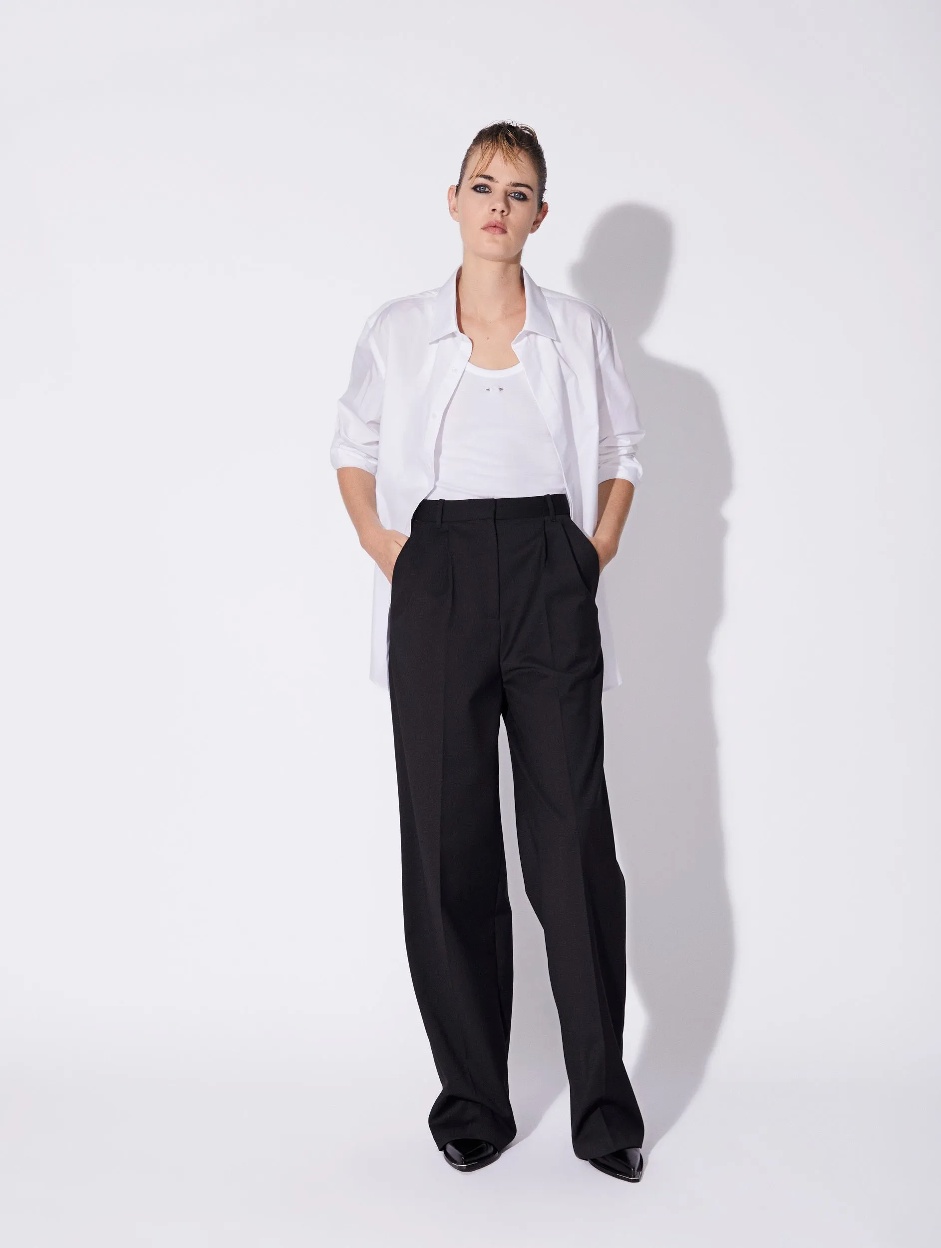 Black stretch wool high waisted pleated trousers