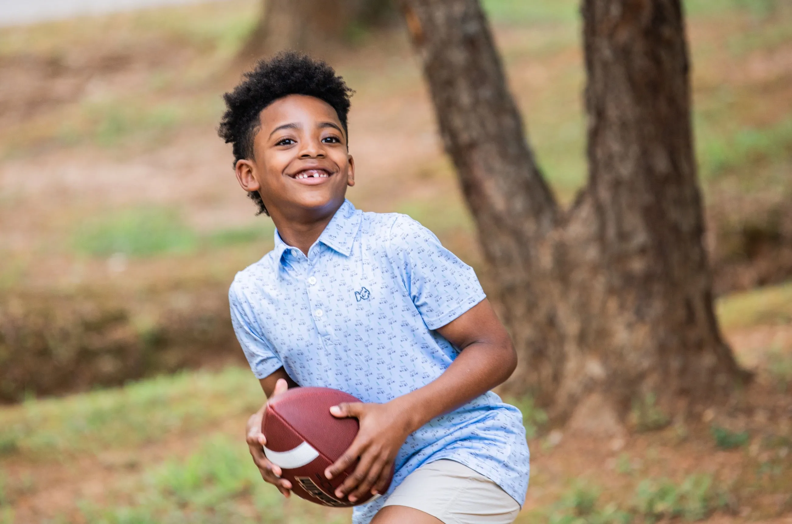 Boys' Short Sleeve Pro Performance Polo in Powder Blue Golf Cart Print