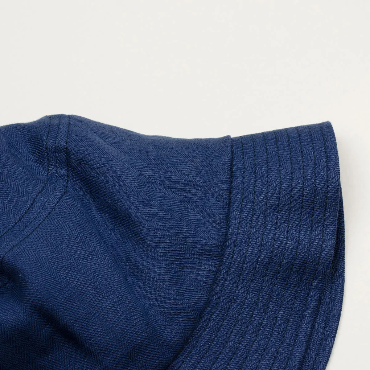 cableami Indigo Linen Herringbone Bucket Hat.